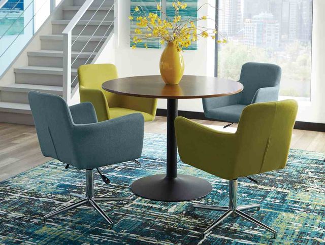 front view of a contemporary dining space with a round pedestal table and four blue and green chairs