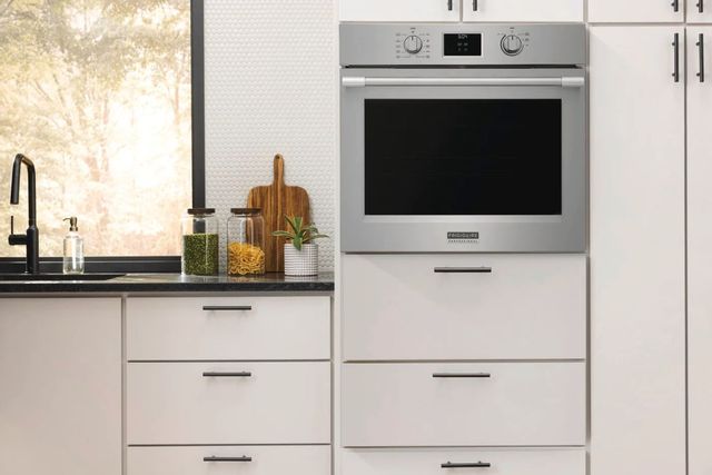 front view of a wall oven built into white cabinetry