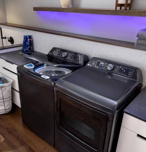 Diamond gray GE Profile washer and dryer in a laundry room