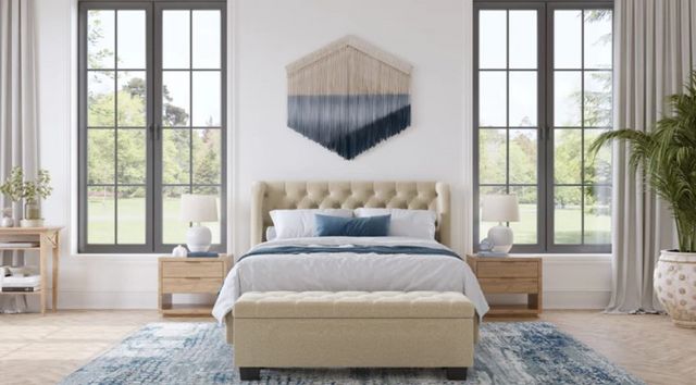 front view of a bed and two nightstands in a modern bedroom with a blue and beige color scheme
