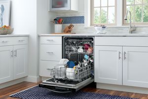 Kitchen featuring Frigidaire Gallery 24" Stainless Steel Built-In Dishwasher loaded with dishes.