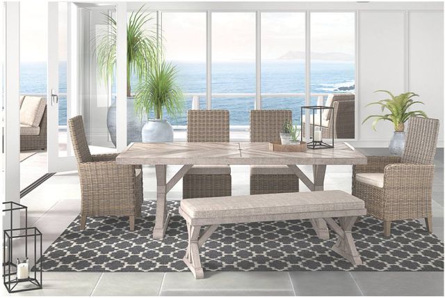 front view of a modern enclosed patio with an outdoor dining table inside