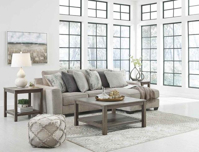 front view of a beige sofa with chaise in a cozy modern living room