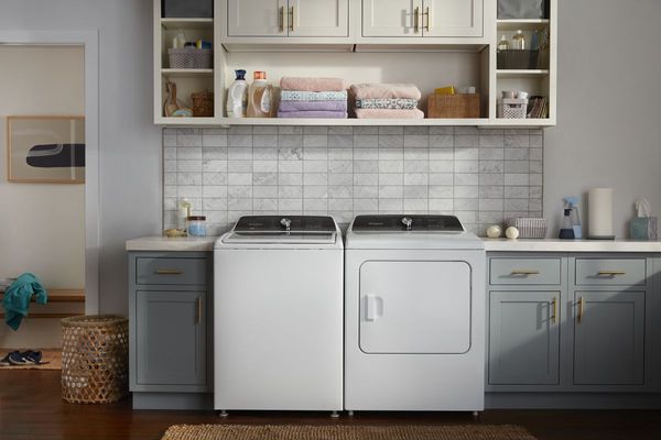 Whirlpool Laundry Pair Modern laundry room with Whirlpool high-efficiency washer and dryer pair in white finish