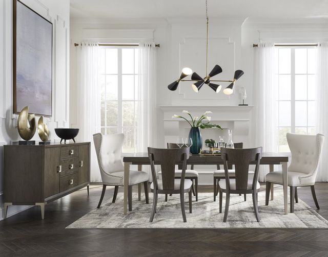 view of a modern contempoarary dining room with a rectangular dining table with six seats and a matching sideboard.