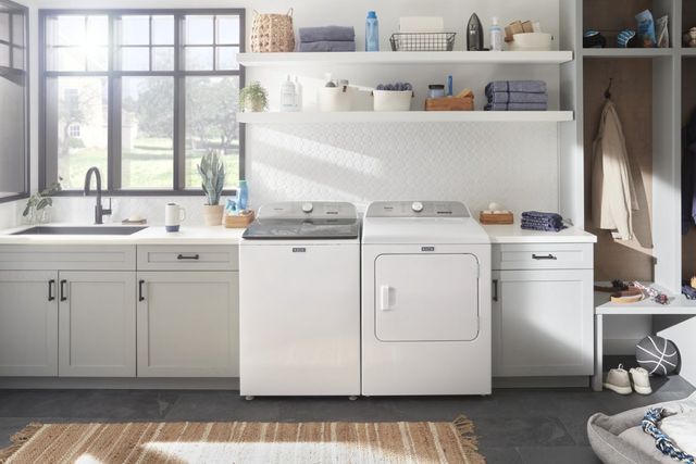 front view of the maytag pet pro washer and dryer in a modern white laundry room