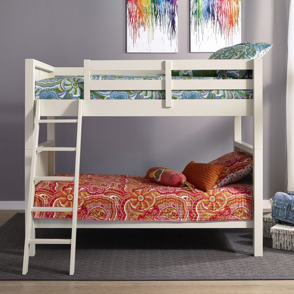 front view of white wood bunk beds with pink and purple bedding, and a crayon melt artwork on the wall behind