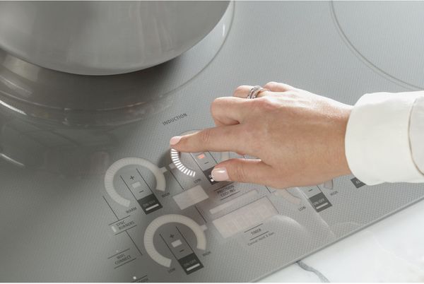 Kitchen Showcasing a Monogram 36" Silver Induction Cooktop