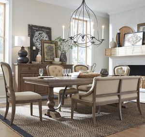 view of the Liberty Americana Farmhouse 6-Piece Beige/Dusty Taupe Trestle Table Set in a modern farmhouse style dining room with white walls