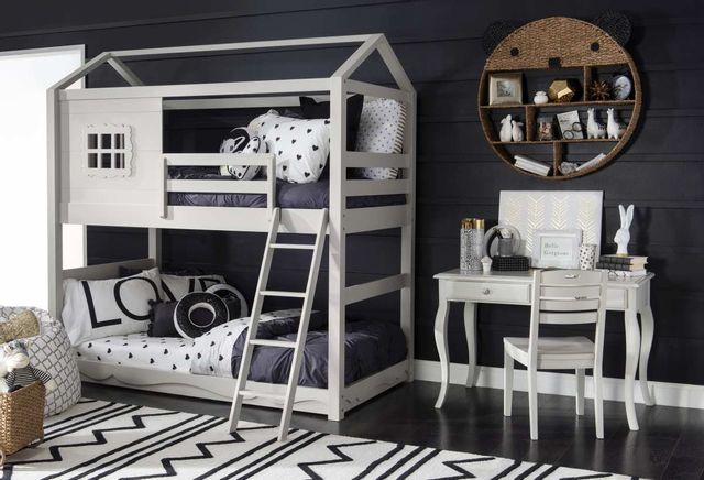 front view of a modern children's room with a white canopy bunk bed and matching white desk and chair