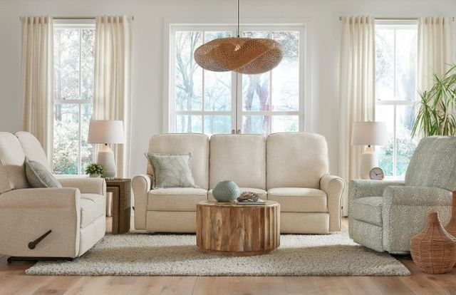 custom-sofa-style-design front view of a modern white sofa in a modern living room with a matching chair and accent chair