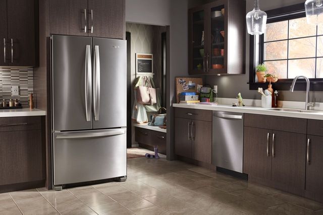 front view of a family kitchen with a stainless steel french door refrigerator
