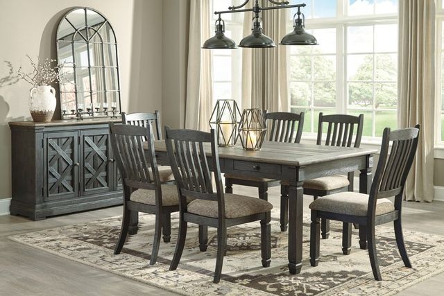 view of a modern beige dining room with a dark wood table and sideboard, and matching chairs