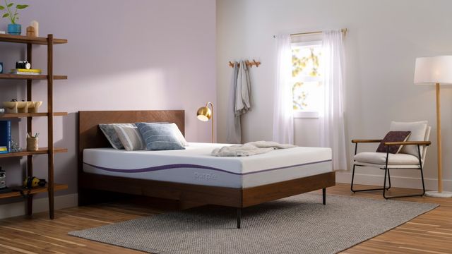 side view of a purple mattress in a modern bedroom