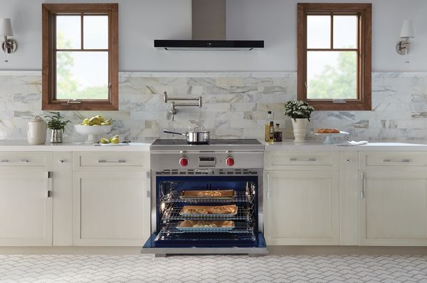 Kitchen featuring white cabinets and Wolf 36" Stainless Steel Professional Induction Range