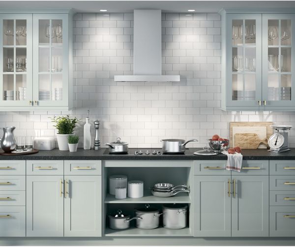 Kitchen Featuring a GE 30" Stainless Steel Wall Mounted Range Hood