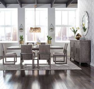 front view of the Liberty Modern Farmhouse 5-Piece Dakota/Dark Gray Trestle Table Set in a modern dining room with white walls