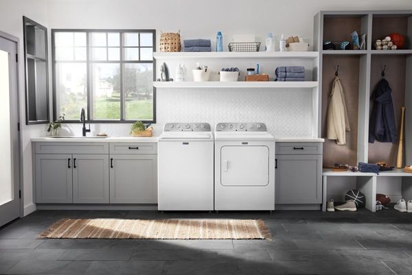 Laundry Room Featuring a Maytag 4.5 Cu. Ft. White Top Load Washer