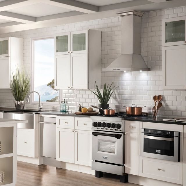 zline range and range hood in a modern white kitchen
