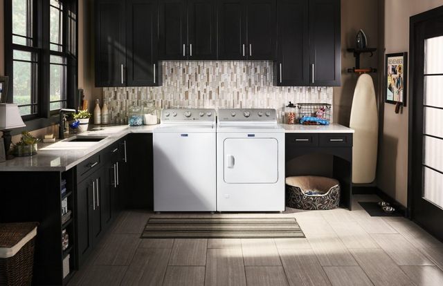 Maytag washer and dryer are located in a laundry room