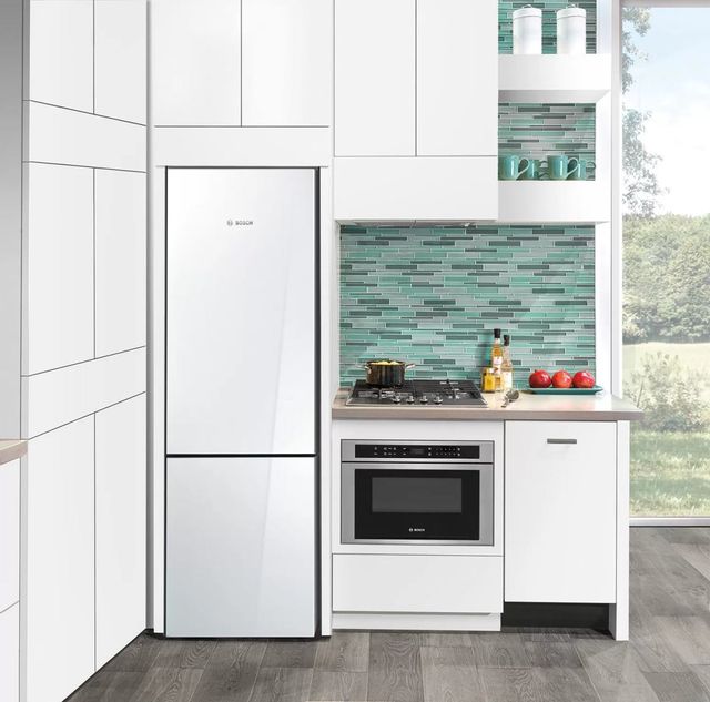 white bottom freezer fridge in white kitchen 