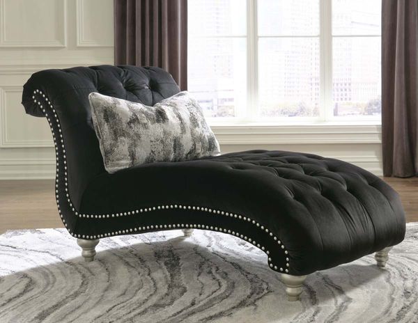 front view of a black velvet chaise lounge chair
