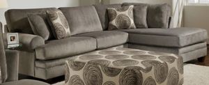 front left view of the Monica Smoke 2-Pc Sectional and matching ottoman
