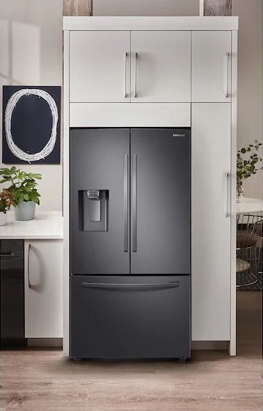 Modern kitchen with black stainless steel appliances.  