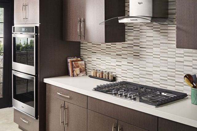 gas cooktop in a light brown kitchen