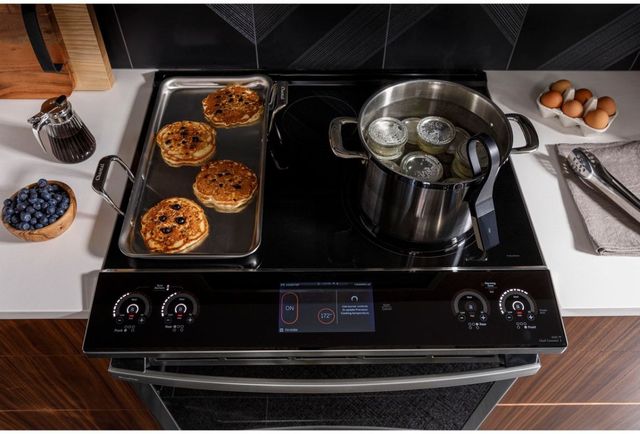 top view of an induction range with breakfast being cooked on top