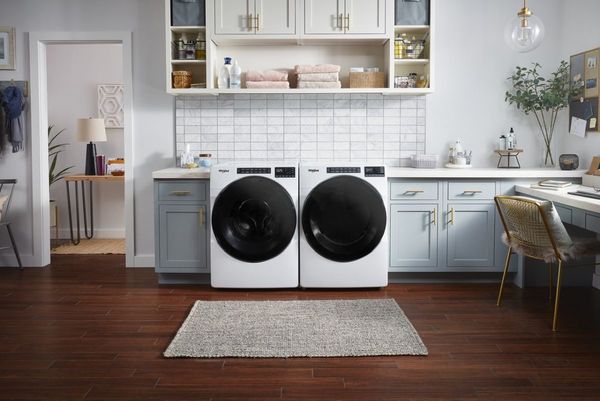 Kitchen Showcasing a Whirlpool 4.5 Cu. Ft. White Front Load Washer