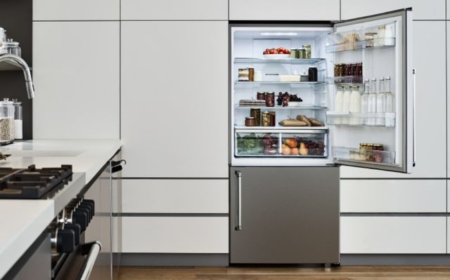 front view of a counter depth bottom freezer refrigerator with the door open to show inside 