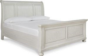 front left view of the Signature Design by Ashley® Robbinsdale Antique White Queen Sleigh Bed, a white wood sleigh bed