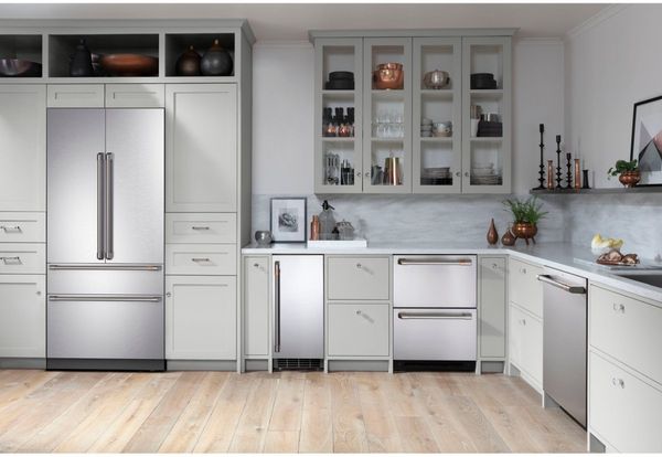 Kitchen Showcasing a Café appliance package including French Door Refrigerator, dishwasher