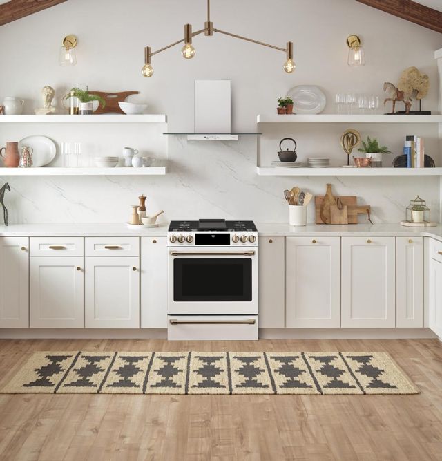 A white range in a bright, airy kitchen