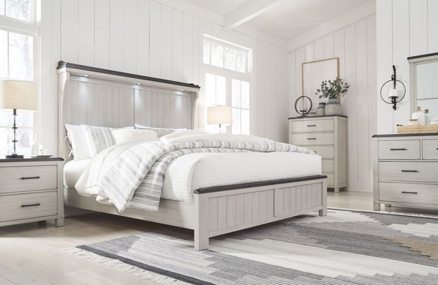 front view of a modern rustic bedroom with white walls and a white bed frame