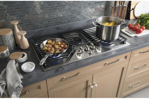 Kitchen Showcasing GE Profile 36" Stainless Steel Gas Cooktop