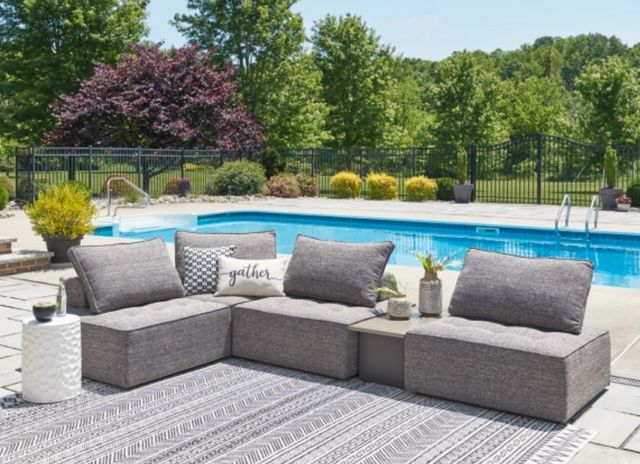 front view of a grey modular outdoor sectional sofa