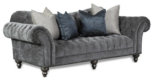 grey velvet upholstered sofa