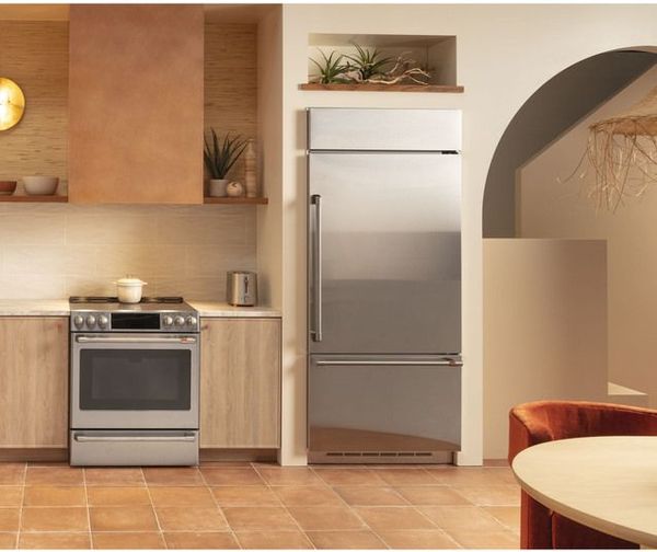 Kitchen Featuring a Café Induction Range and Café refrigerator 