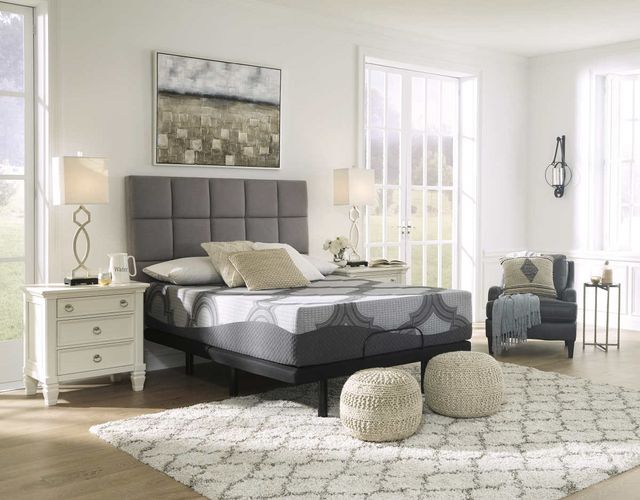 view of a modern white bedroom with a mattress and bed frame set front and center
