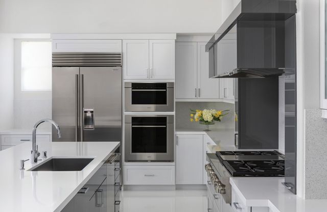 modern white kitchen with sub-zero refrigerator