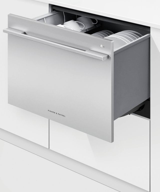 Stainless steel Fisher Paykel dishwasher drawer opens to reveal dishes inside