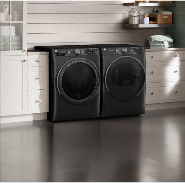 Laundry Room Showcasing a GE Carbon Graphite Front Load Laundry Pair