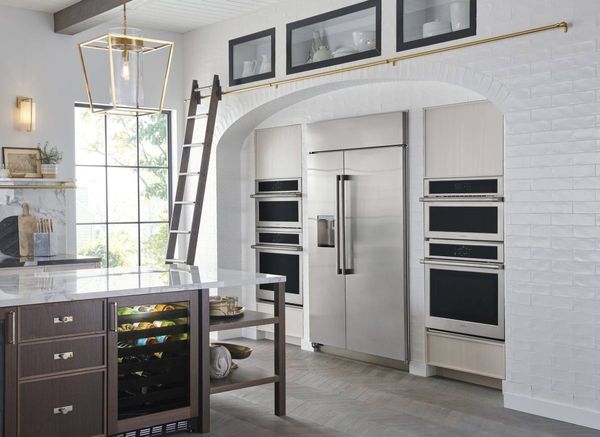 Contemporary Kitchen Featuring a Built In Refrigerator 