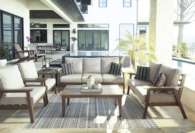 Front view of an outdoor sofa, loveseat, and chairs on a patio