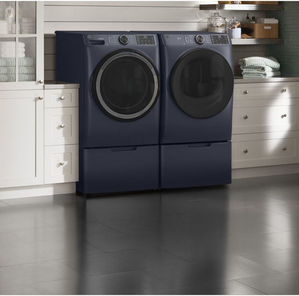 Laundry Room Featuring a GE Sapphire Blue Front Load Laundry Pair