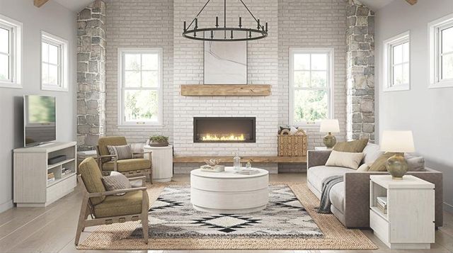 front view of a modern farmhouse living room with white walls and furniture, including a white tv stand with a tv against the left wall 