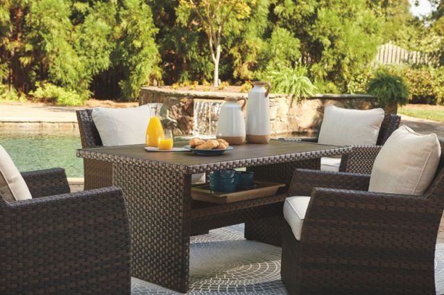 front view of an outdoor patio with a synthetic wicker outdoor dining set