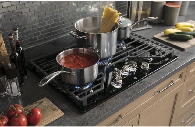 GE Profile Gas cooktop with pots cooking pasta